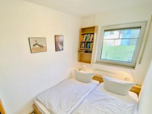 Postel nebo postele na pokoji v ubytování Boddenkieker 18