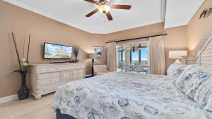 a bedroom with a bed and a ceiling fan at The Oasis at Orange Beach 1002 (Phoenix West II) in Orange Beach +92 photos