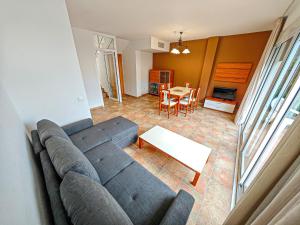 A seating area at LITORAL COSTA DORADA - LAS CUMBRES Only families