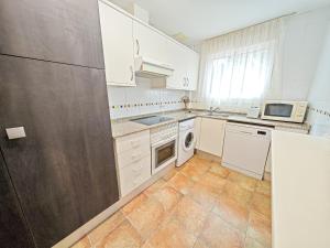 A kitchen or kitchenette at LITORAL COSTA DORADA - LAS CUMBRES Only families