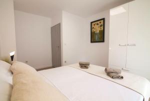 Posteľ alebo postele v izbe v ubytovaní Helvetia Sunny Apartments
