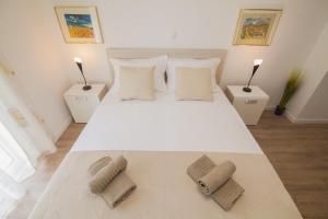 Posteľ alebo postele v izbe v ubytovaní Helvetia Sunny Apartments