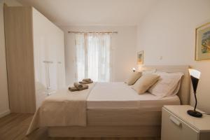 Posteľ alebo postele v izbe v ubytovaní Helvetia Sunny Apartments