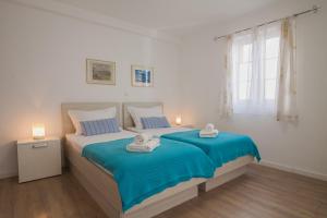 Posteľ alebo postele v izbe v ubytovaní Helvetia Sunny Apartments