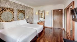 Posteľ alebo postele v izbe v ubytovaní Sercotel Hotel President