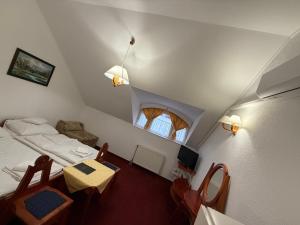 Postel nebo postele na pokoji v ubytování Fodor Hotel