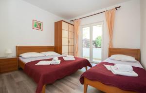 Giường trong phòng chung tại Apartment Karlo