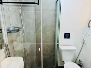 a bathroom with a shower and a toilet at Modern Studio in Catete – Close to the Metro in Rio de Janeiro