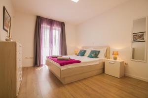 Posteľ alebo postele v izbe v ubytovaní Helvetia Sunny Apartments