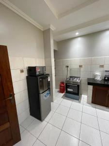 Η κουζίνα ή μικρή κουζίνα στο Creek Heights Apartment