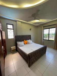 Ένα ή περισσότερα κρεβάτια σε δωμάτιο στο Creek Heights Apartment