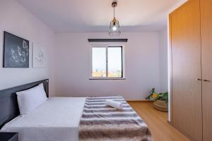 Postel nebo postele na pokoji v ubytování Zezita's Place