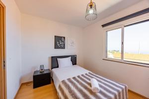 Postel nebo postele na pokoji v ubytování Zezita's Place