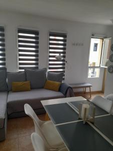 a living room with a couch and a table at Apartamento Ocean in Arinaga