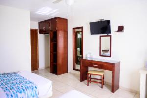 Postel nebo postele na pokoji v ubytování Hotel Acuario En Ocotlán