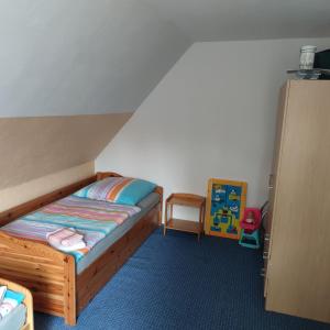 Ένα ή περισσότερα κρεβάτια σε δωμάτιο στο Ferienwohnung in Hirschau +12 φωτογραφίες