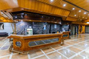 a large lobby with a bar in a building at Hotel Pan Americano in Sao Paulo