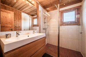 a bathroom with a sink and a shower at Chalet Les Amborzales in Taninges +22 photos