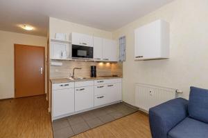 Kuchyň nebo kuchyňský kout v ubytování Yachthafenresidenz-Wohnung-9309-906 + 6 fotografií