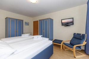 Postel nebo postele na pokoji v ubytování Yachthafenresidenz-Wohnung-9309-906