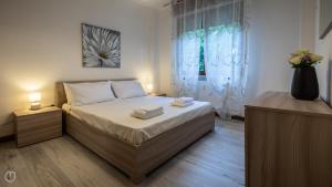 Posteľ alebo postele v izbe v ubytovaní Italianway - Bersaglio 25 + 21 fotografií