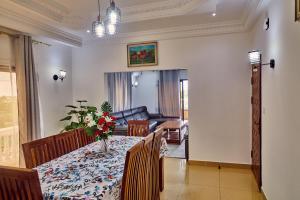 a living room with a table and a couch at SERENITY Flat2 in Pointe-Noire