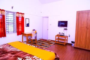 TV a/nebo společenská místnost v ubytování Vibe inn kodai