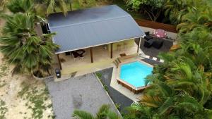 an overhead view of a house with a swimming pool at Wakerasuites in Les Abymes