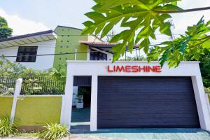 a garage with a kingsline sign on top of it at Limeshine - Airport Transit Hotels & Residences in Katunayaka +88 photos