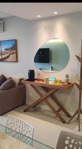 TV/trung tâm giải trí tại Marulhos Resort vista Piscina flat Premium