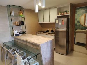 Nhà bếp/bếp nhỏ tại Marulhos Resort vista Piscina flat Premium