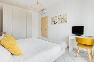 TV a/nebo společenská místnost v ubytování HQ Aparthotel Milano Inn - Smart Suites