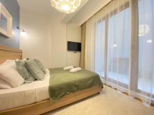 Postel nebo postele na pokoji v ubytování Şişli Of Apartment No 12 + 1 fotografie