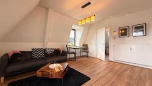 Χώρος καθιστικού στο Hugos Nest Ferienwohnung Neumünster WLAN & Arbeitsplatz