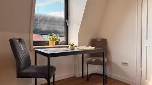 Φωτογραφία από το άλμπουμ του Hugos Nest Ferienwohnung Neumünster WLAN & Arbeitsplatz σε Neumünster