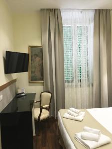 Antico Hotel Moderno客房内的一张或多张床位