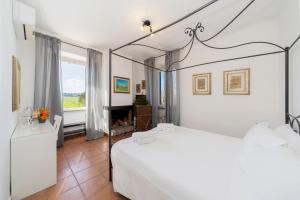 Ένα ή περισσότερα κρεβάτια σε δωμάτιο στο Casale Acquasanta