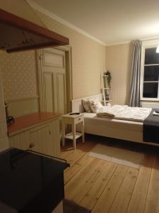 Postel nebo postele na pokoji v ubytování Kungsgården BnB