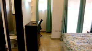 Postel nebo postele na pokoji v ubytování Blue Star Apartments & Hotel