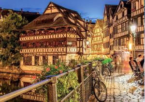 an old building on a street in a city at Appart Terrasse in Strasbourg