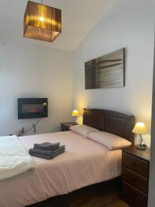 Katil atau katil-katil dalam bilik di Apartamento Arco del Cristo