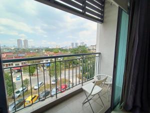 a balcony with a chair and a view of a parking lot at PJ5 Soho Studio Room Washer WiFi Parking in Petaling Jaya