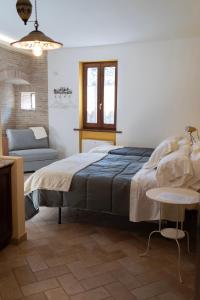 Postel nebo postele na pokoji v ubytování My Home Assisi