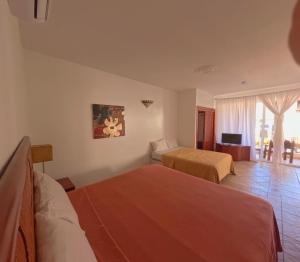 Voodi või voodid majutusasutuse West Bay Colonial toas