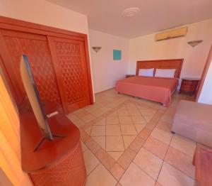 Voodi või voodid majutusasutuse West Bay Colonial toas