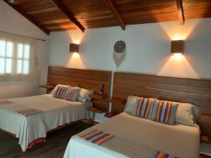 Postel nebo postele na pokoji v ubytování Hotel Quiloma Ranch
