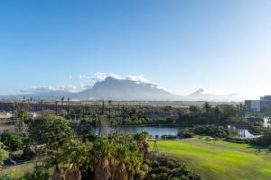 a view of a park with a mountain in the background at Prada Penthouse at On Park Century City in Cape Town