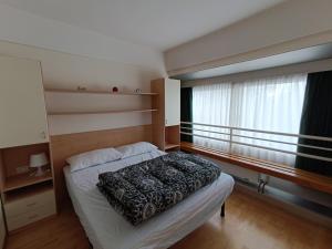 Postel nebo postele na pokoji v ubytování Appartamenti Vacanze Casa -Residence Albare - check in Vacanze Casa - Marilleva 900