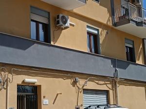 a building with a air conditioner on the side of it at Casa Letizia in Lercara Friddi