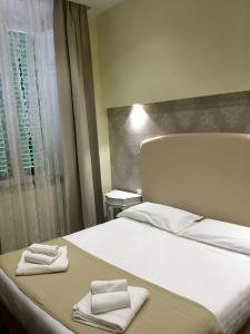 Antico Hotel Moderno客房内的一张或多张床位